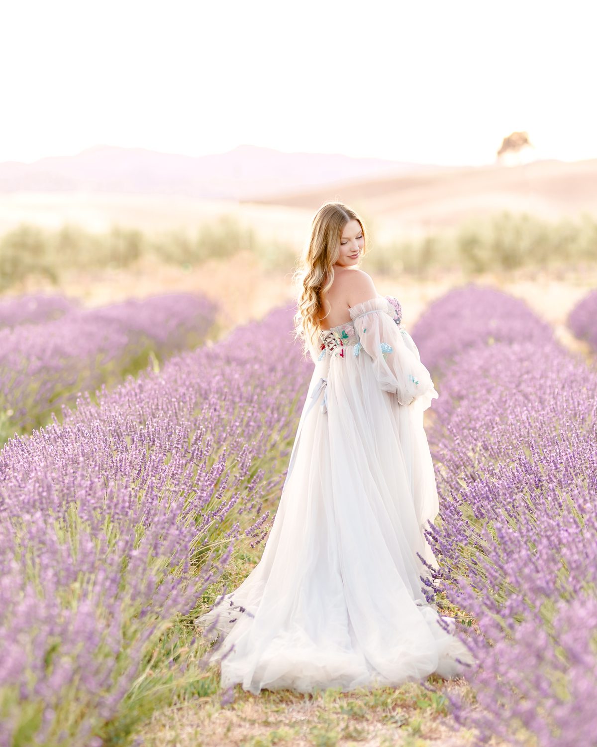 Expecting mother in a maternity gown at Capay Valley Lavender Field
