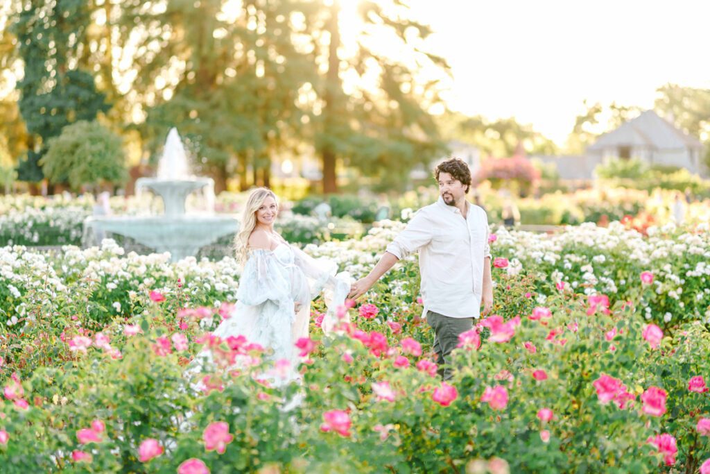 San Jose maternity portrait of a couple in a rose garden