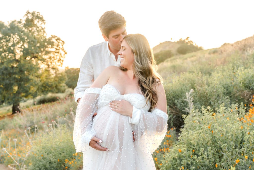 Expecting parents in a Walnut Creek CA poppy field