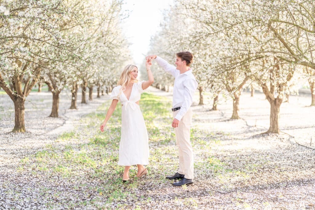 A couple dancing in Bay Area Almond Blossom Field