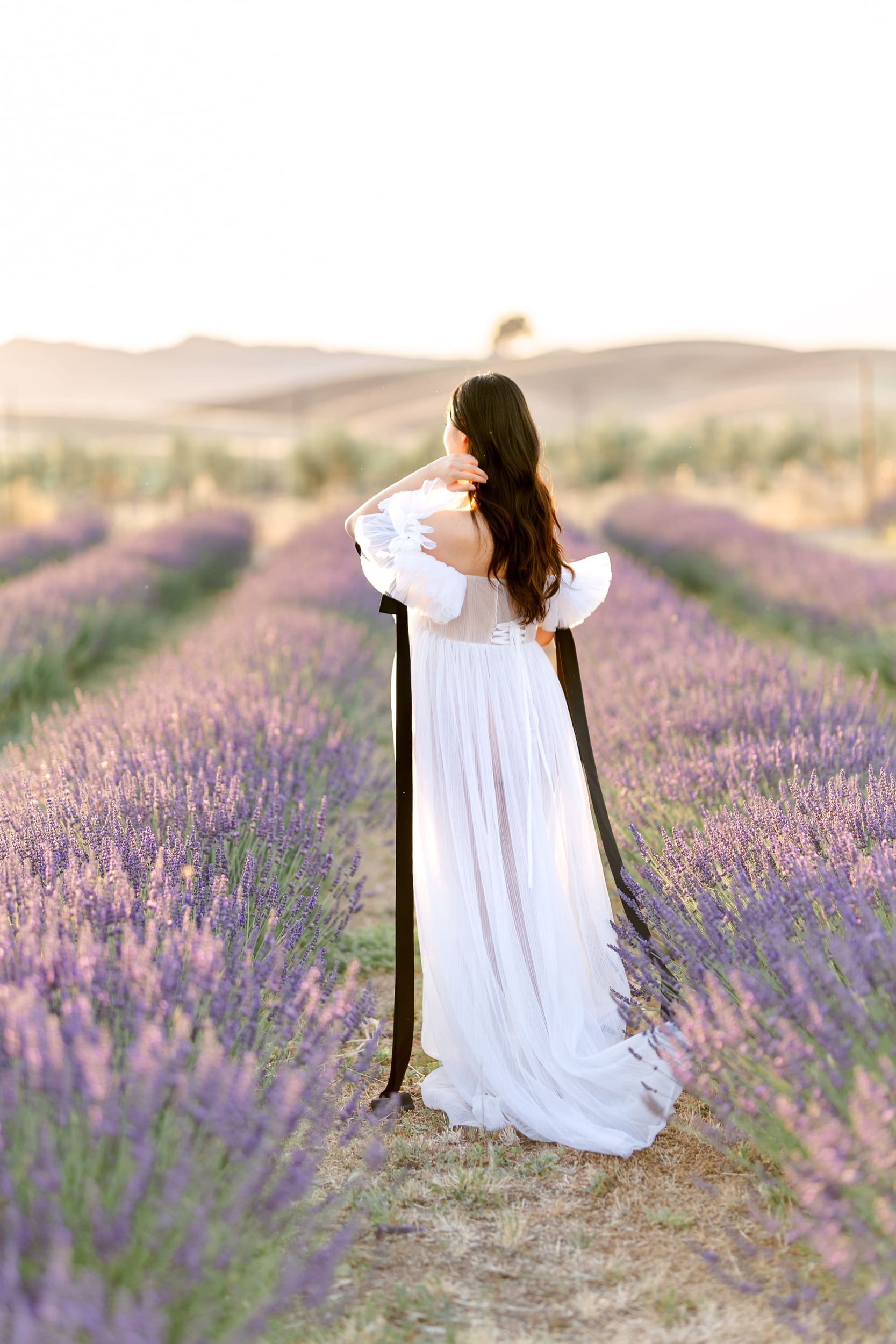 Woman in white gown in a Bay Area Lavender Field